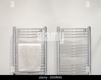 Towel on heated towel rail Stock Photo