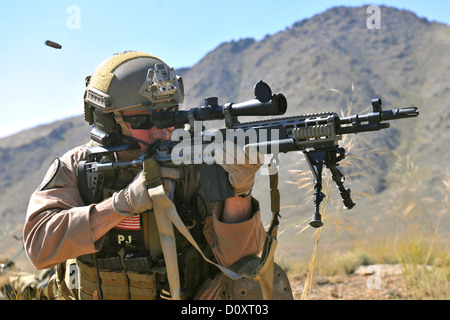 A US Air Force Brig. Gen. test fires the M14, an enhanced battle rifle during a training mission September 24, 2010 at Bagram Airfield, Afghanistan. Stock Photo