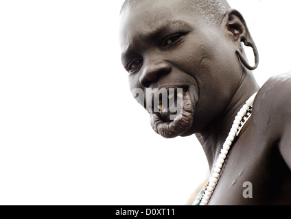 Portrait Of A Surma Tribe Woman With Enlarged Lip And Ears, Omo Valley, Ethiopia Stock Photo