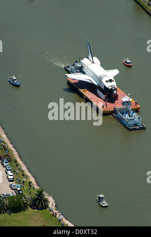 The NASA training shuttle is taken by barge safely through the tight ship channel June 1, 2012 in Kemah, Texas as it made its way to the Johnson Space Center. Stock Photo