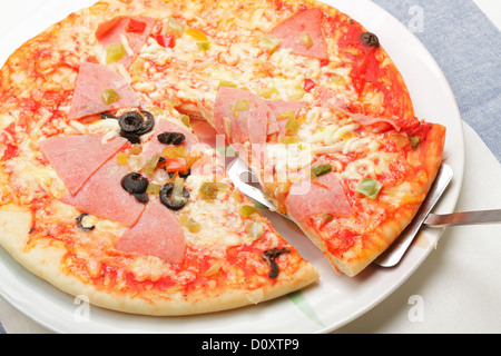 Slice of pizza on spatula Stock Photo