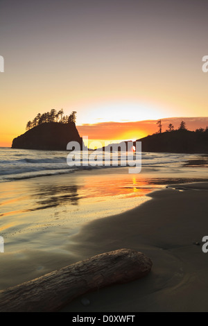 Sunset through rock arch, Second Beach near La Push, Olympic National Park, Washington, USA Stock Photo