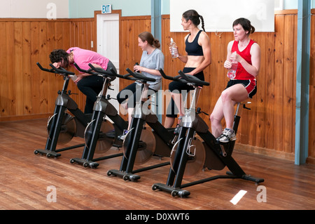 Exhausted woman in spinning class Stock Photo