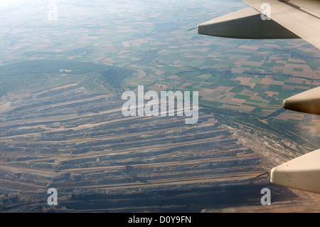 View of an open-cast coal mine from a commercial passenger airliner Stock Photo