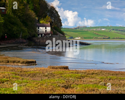 View towards the boathouse once used by Dylan Thomas in Laugharne Carmarthenshire South Wales UK on the River Taf estuary Stock Photo
