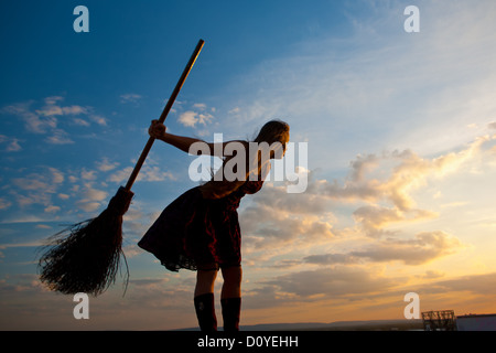 pretty witch with broom Stock Photo