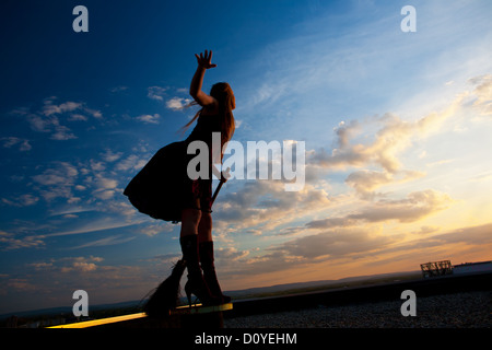 pretty witch with broom Stock Photo