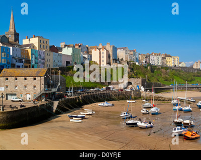 View of small boats in the harbour and the Old Town in Tenby Pembrokeshire South Wales UK a seaside resort in Carmarthen Bay Stock Photo