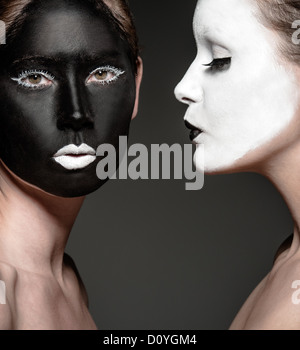 two young girls with ying yang style makeup Stock Photo