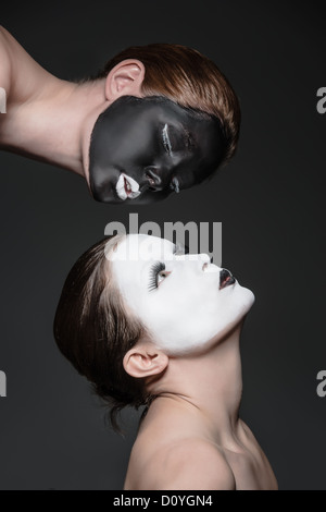 two young girls with ying yang style makeup Stock Photo