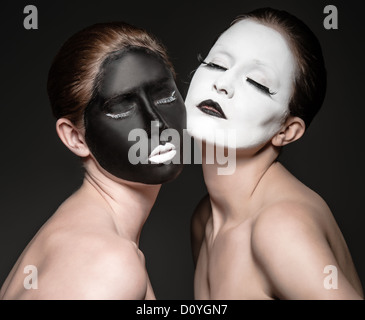 two young girls with ying yang style makeup Stock Photo