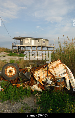 Destroyed car in a bayou near Grand Isle Louisiana Stock Photo