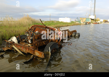 Destroyed car in a bayou near Grand Isle Louisiana Stock Photo