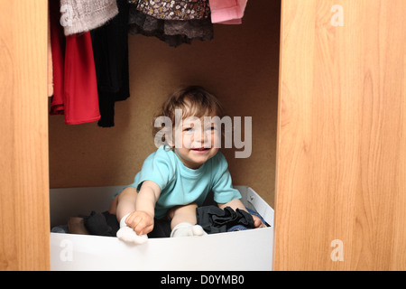 Child in wardrobe Stock Photo