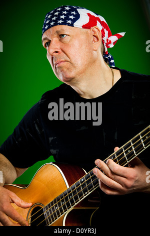 man with a guitar, bass player Stock Photo