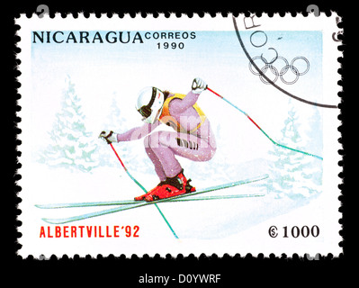 Postage stamp from Nicaragua depicting a downhill skier, issued for the 1992 Winter Olympic Games in Albertville. Stock Photo