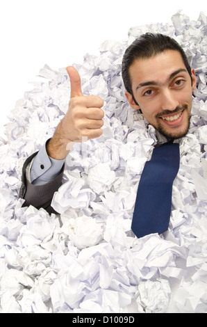 Man with lots of crumpled paper Stock Photo