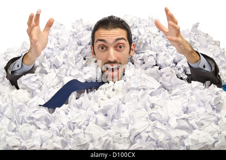 Man with lots of crumpled paper Stock Photo