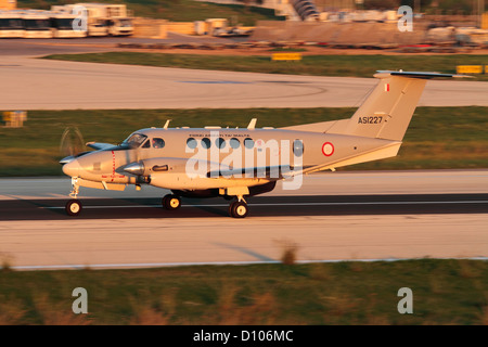 Beechcraft King Air maritime patrol aircraft (MPA) of the Armed Forces of Malta taking off at sunset Stock Photo