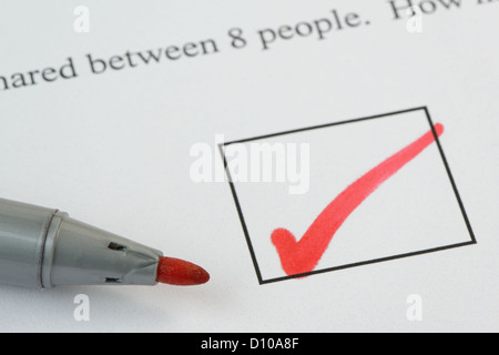 Tick mark on an exam paper, with pen. Text not subject to copyright. 36 mp image Stock Photo