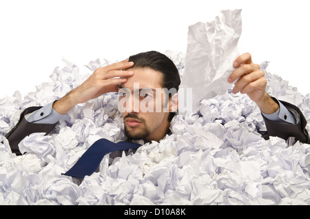 Man with lots of crumpled paper Stock Photo