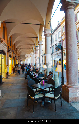 Cafe terraces under porticoes along Via Emilia street central Modena city Emilia-Romagna region central Italy Europe Stock Photo