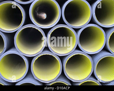 set of yellow and gray corrugated tubes for the laying on site Stock Photo