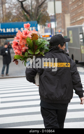 Flower store delivery man with a bouquet of flowers New York USA Stock Photo