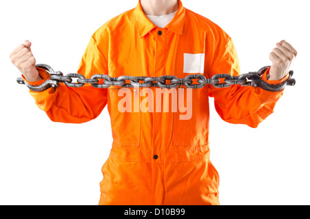 Criminal in orange robe in prison Stock Photo