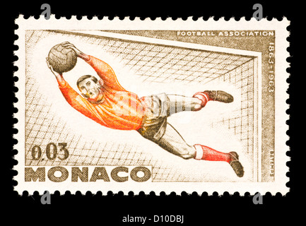 Postage stamp from Monaco depicting a soccer goalkeeper. Stock Photo