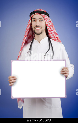 Arab doctor with blank message board Stock Photo
