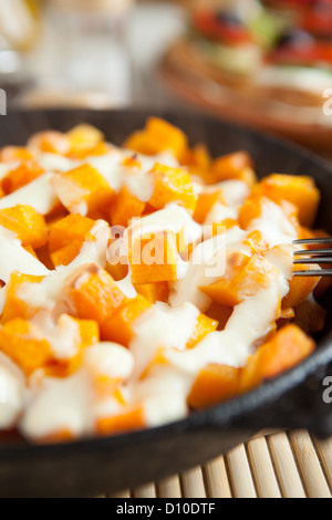 Slices of pumpkin and cream cooked in the oven, close up food Stock Photo