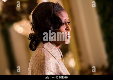 First Lady Michelle Obama delivers remarks during the 2012 White House christmas decorations preview.  Stock Photo