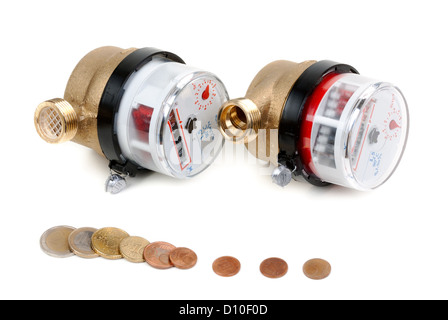 Water meters and coins with euro money. Isolate on white. Stock Photo