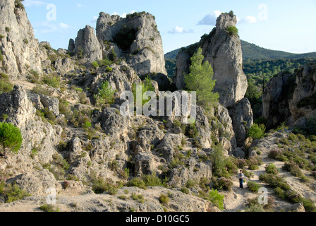 Dolomite rock columns, person on footpath, Cirque de Moureze, Moureze, Languedoc-Roussillon, France, Europe Stock Photo