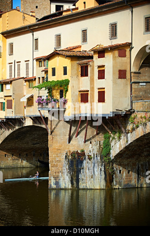 The Ponte Vecchio bridge with its shops spanning the Arno River, Florence Italy