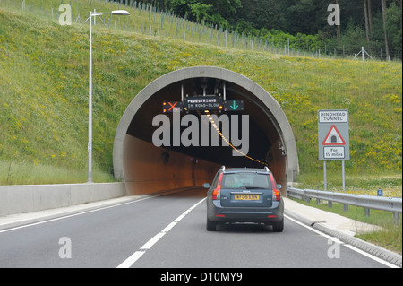 North portal of Hindhead Tunnel on the A3 in Surrey,displaying warning signs for single lane closure Stock Photo