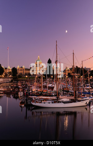 Victoria Inner Harbour at dusk with masts of Classic Boats, Victoria, British Columbia BC, Canada Stock Photo