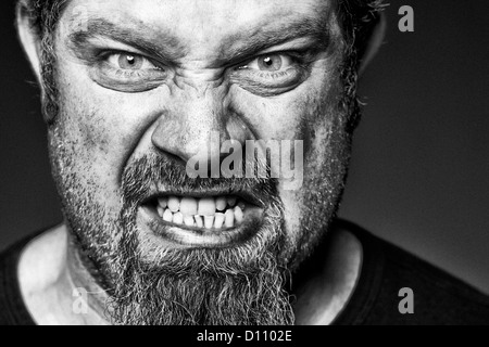 Angry man with sneer on his face. Stock Photo