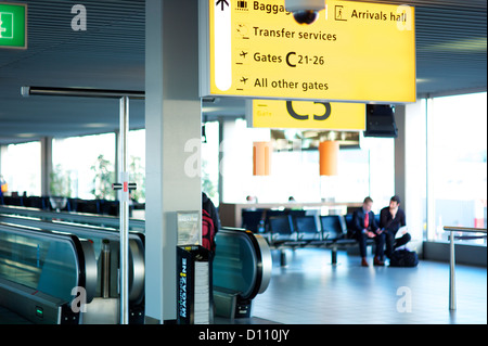 Two business men seated in an airport terminal Stock Photo