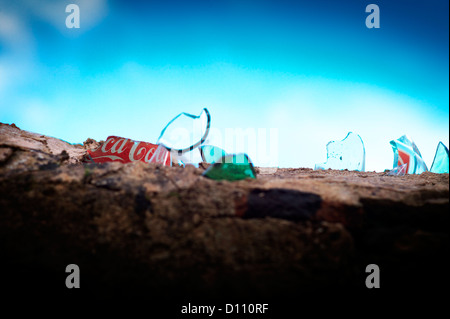 Detail of broken glass on top of a  wall against blue sky Stock Photo