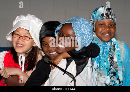 Fun loving Muslim and white students portraying the early days of Minnesota life. Horace Mann School. St Paul Minnesota MN USA Stock Photo