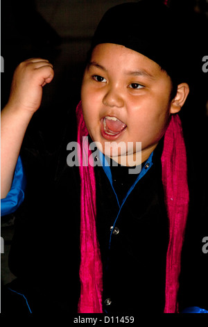 Asian American boy age 10 in ceremonial costume portraying early days in Minnesota. Horace Mann School. St Paul Minnesota MN USA Stock Photo