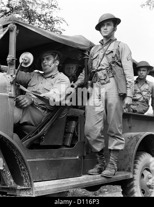 1940s US ARMY SOLDIERS RIDING ON MILITARY TRUCK Stock Photo