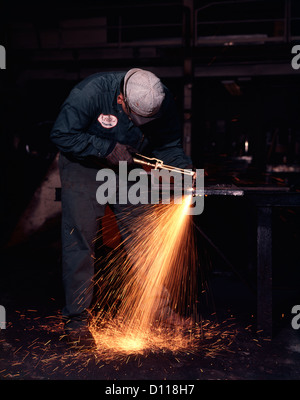 1970s STEELWORKER WELDING STEEL SPARKS FLYING Stock Photo