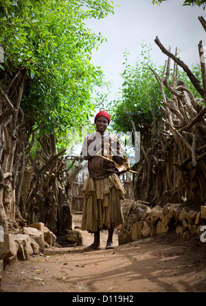 Portrait Of A Konso Tribe Woman Posing In Village Alley, Konso, Omo Valley, Ethiopia Stock Photo