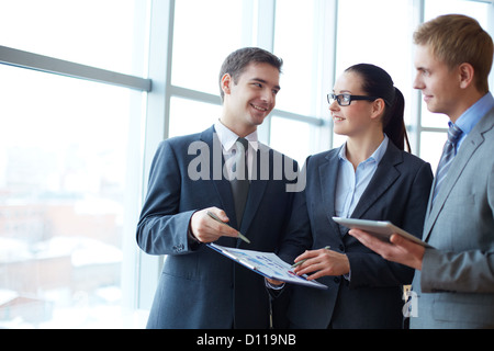 Image of group of employees discussing new ideas or project at meeting Stock Photo