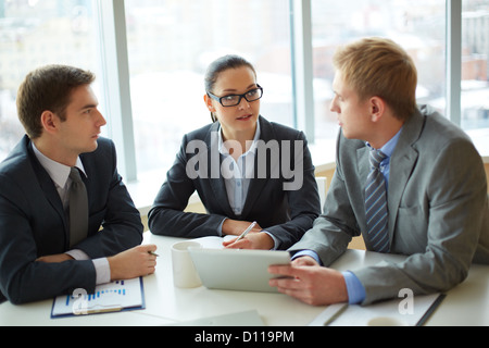 Image of group of employees discussing new ideas or project at meeting Stock Photo
