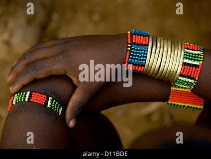 Close Up On The Golden And Colourful Bracelets Of A Hamar Tribe Woman, Omo Valley, Ethiopia Stock Photo