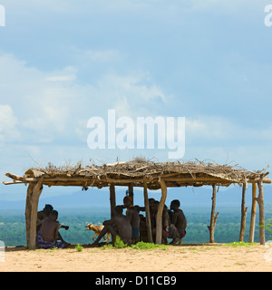 Karo Tribe Men Gathered Under A Chifo, Korcho Village, Ethiopia Stock Photo